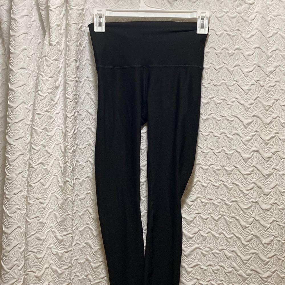 Black size 4 lululemon leggings, never worn, without tags.